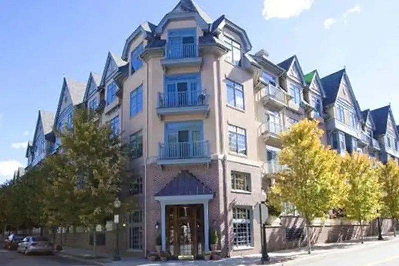 Corner entrance of the Marbury Corners condominium building